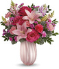 In Teleflora's Rosy Swirls vase.