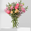 15 stems of florals and foliage in vase.